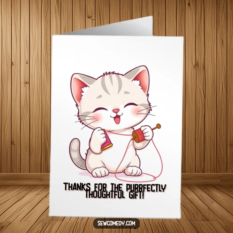 Funny free printable thank you card with a playful kitten batting at a needle, surrounded by a spool of thread.
